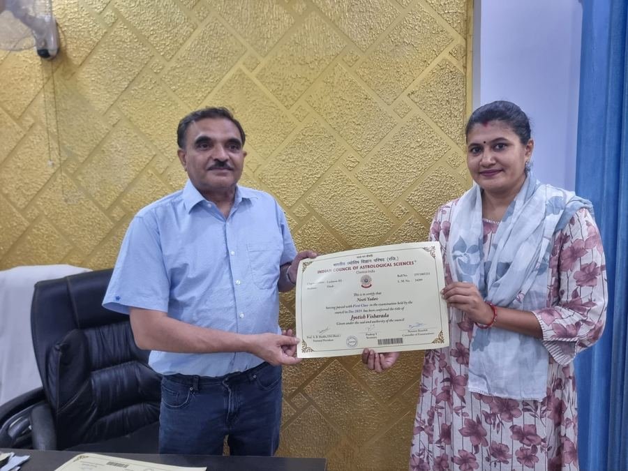 A graduate receiving her Jyotish Visharada certificate